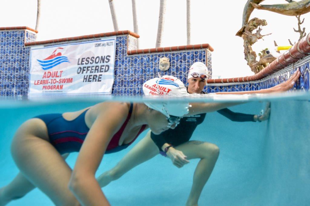 a lady being taught how to swim at United States Masters Swimming (USMS)