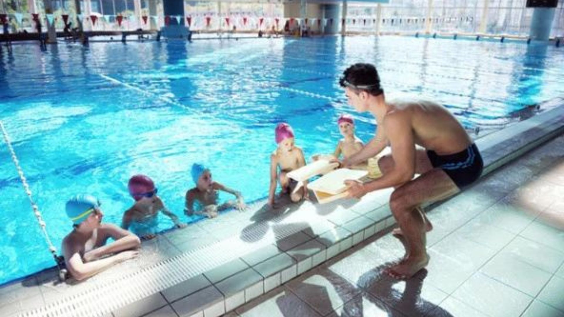 People in a pool Choosing the Right Swimming Club.