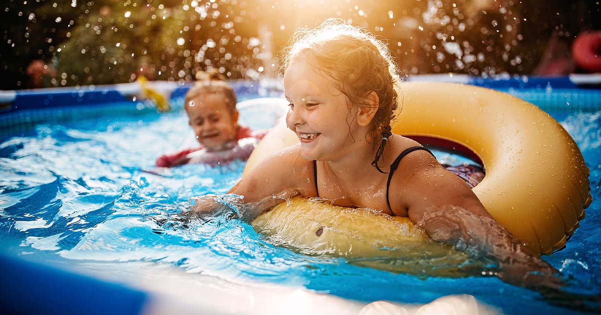 a girl child swimming at a club